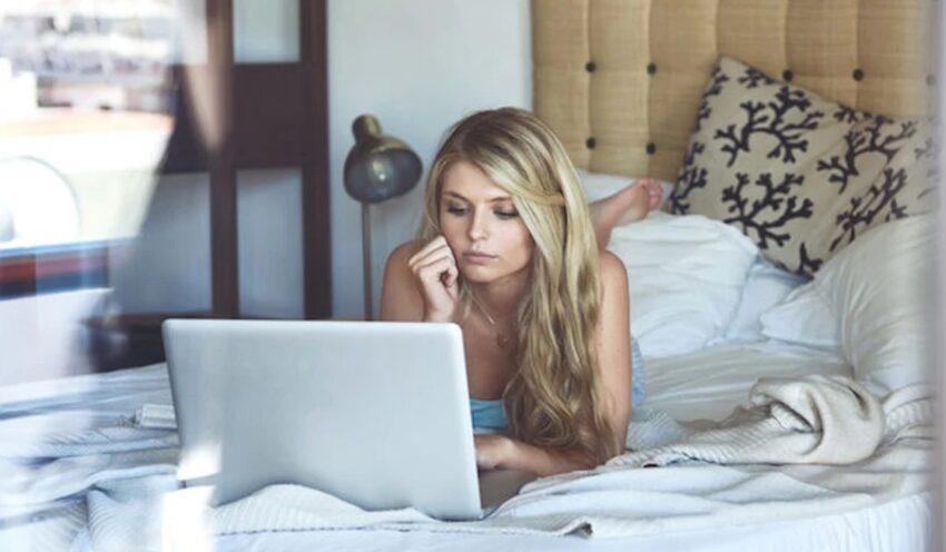 blonde girl chatting using laptop